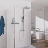A modern bathroom with a shower system and bathtub. Produktbild-Vorschau