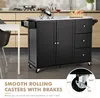 A black kitchen cart with a stainless steel top is shown in a kitchen setting. The cart has drawers and cabinet doors. Text overlays highlight features like "SMOOTH ROLLING CASTERS WITH BRAKES". Náhľad obrázku produktu