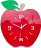 A red apple-shaped clock with a green leaf and a tan stem. Produktbild-Vorschau