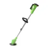 A green and silver electric grass trimmer is shown against a white background. Podgląd zdjęcia produktu