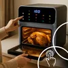 A person is using a black air fryer with a whole roasted chicken inside. The air fryer has a digital display showing '180'. Produktbild-Vorschau