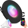A black round LED downlight with a colorful light effect and a separate GU10 smart bulb, along with a hand holding a smartphone displaying a color selection app. Produktbild-Vorschau