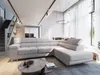 A modern living room with a sectional sofa, coffee table, and stairs. Produktbild-Vorschau