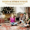 Three children sitting on a rug in front of a Christmas tree with presents. Produktbild-Vorschau