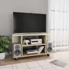 A TV stand with a TV, speakers, and electronic equipment in a room. Náhľad obrázku produktu