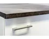 A close-up view of a white cabinet with a gray countertop and a silver handle. Náhled obrázku produktu