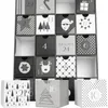 A black and white advent calendar with 24 numbered drawers, some of which are pulled out. Náhled obrázku produktu
