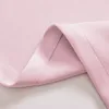 A close-up view of pink fabric, showing the texture and stitching of a curtain. Náhľad obrázku produktu