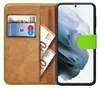 A book-style phone case with slots for cards and cash, showing a Samsung Galaxy S21 Plus phone inside. Produktbild-Vorschau