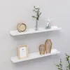 Two white wall shelves are mounted on a light gray wall, displaying various decorative items. Produktbild-Vorschau