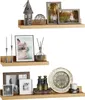 Three wooden shelves displaying various decorative items, including picture frames, candles, a lantern, a globe, binoculars, a clock, and a candle holder. Produktbild-Vorschau