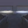 Two cars parked in front of a garage with their headlights on. Produktbild-Vorschau