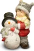 A decorative figurine of a girl hugging a snowman. Podgląd zdjęcia produktu