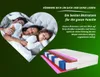 A family sleeping in a heart-shaped frame, with a cutaway view of a mattress and promotional text. Anteprima dell’immagine prodotto