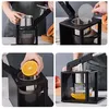 A collage of four images showing the use of a manual juicer. Produktbild-Vorschau