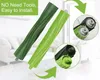 Two green vacuum cleaner brush rolls are displayed diagonally on a light-colored floor with a blurred background of a living room. Podgląd zdjęcia produktu