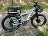 An electric bicycle parked on a paved path with grass and trees in the background. Produktbild-Vorschau