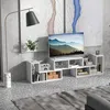 A modern living room setup featuring a white TV stand with a television and various decorative items. Produktbild-Vorschau