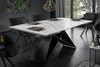 A modern dining room with a marble-top dining table and black chairs. Produktbild-Vorschau