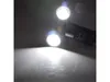 A close-up shot of a dual-head LED garden light with its lights on, illuminating a surface. Produktbild-Vorschau