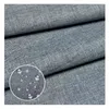 A close-up view of gray fabric, with a circular inset showing water droplets on the fabric, indicating its waterproof quality. Produktbild-Vorschau