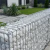 Weiße Kieselsteine in einer metallischen Gabionenwand als Gartenzaun Produktbild-Vorschau
