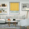 A living room scene with a sofa, coffee table, and window with blinds. Produktbild-Vorschau
