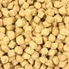 A close-up, overhead view of many small, cube-shaped bird treats. Produktbild-Vorschau