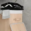 A close-up view of a laundry basket with folded clothes on top and a towel draped over the side. Podgląd zdjęcia produktu