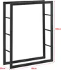 A black metal firewood rack with dimensions indicated by red lines and text. Produktbild-Vorschau