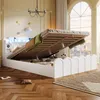 A bedroom with a bed that has its storage compartment open, showing the interior. The room has large arched windows with a view of a city skyline. Anteprima dell’immagine prodotto
