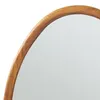 A close-up view of the wooden frame of a mirror. Anteprima dell’immagine prodotto