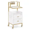 A white and gold rolling trolley with two drawers and two shelves. Produktbild-Vorschau