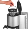 A hand is holding a reusable coffee filter over a coffee maker. Produktbild-Vorschau