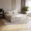 A bedroom scene with a bed as the focal point, decorated in neutral tones. Produktbild-Vorschau