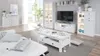 A bright and modern living room interior featuring white furniture and decor. Produktbild-Vorschau