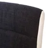 A close-up view of the top corner of a bar stool, showing the dark gray fabric upholstery and a white faux leather trim. Voir les images du produit