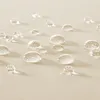 Close-up of water droplets on a textured fabric surface. Náhled obrázku produktu