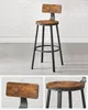 A bar stool with a wooden seat and backrest and black metal legs, shown from multiple angles. Náhled obrázku produktu