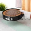 A cake is being removed from a springform pan. Náhled obrázku produktu