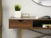 A close-up view of a modern desk with a drawer and an open shelf. Voir les images du produit