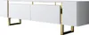 A white TV cabinet with gold legs and accents, shown from a side angle against a white background. Náhľad obrázku produktu