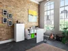 A modern home office with a brick wall, large windows, and a desk setup. Náhľad obrázku produktu