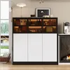 A modern sideboard with glass doors and LED lighting, placed in a living room or dining area. Produktbild-Vorschau