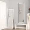 A hallway or entryway with a white door, a full-length mirror with LED lighting, and a white bench. Produktbild-Vorschau