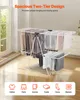 A two-tier drying rack with clothes hanging on it, placed in a room with a window and wooden floor. Icons representing different clothing items are shown at the bottom. Anteprima dell’immagine prodotto