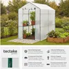A greenhouse in a garden setting, with text describing its features. Produktbild-Vorschau