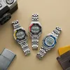Three Seiko digital watches are laid out on a light brown surface, with a vintage camera, a lighter, and a cassette tape visible in the background. Náhled obrázku produktu