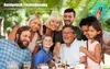 A multi-generational family is taking a selfie outdoors at a table, with a young boy holding a selfie stick. Produktbild-Vorschau