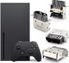 A collage showing an Xbox Series X console and controller, along with several HDMI port connectors. Produktbild-Vorschau
